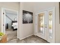 Bright entryway with a view of a bedroom and glass-paned door at 1942 J Lawson Blvd, Orlando, FL 32824
