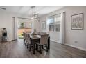Bright dining area with a large table and six chairs, adjacent to the kitchen at 242 Aberdeen St, Davenport, FL 33896