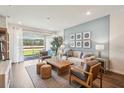 Bright living room with comfy seating and large windows at 2592 Kinsale Ln, Ormond Beach, FL 32174