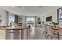 Open concept kitchen with granite countertops and stainless steel appliances at 2913 Hudson Hammock Way, St Cloud, FL 34773