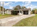 House exterior showcasing carport and driveway at 2959 Sun Pointe Ct, Kissimmee, FL 34741