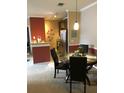 Kitchen with granite countertops, dark wood cabinets, and a breakfast bar at 3757 Conroy Rd # 2525, Orlando, FL 32839
