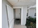 Front entrance with a white door and storm door at 4465 Ne 2Nd Ct, Ocala, FL 34479