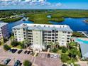 Aerial view of Riverwalk Condo building showcasing the waterfront amenities and parking at 5 Riverwalk Dr # 503, New Smyrna Beach, FL 32169