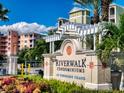 Riverwalk Condominiums at Coronado Island entrance sign, showcasing lush landscaping and community curb appeal at 5 Riverwalk Dr # 503, New Smyrna Beach, FL 32169