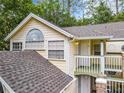 Charming condo featuring an arched window, balcony, and neutral paint scheme at 5003 Laguna Bay Cir # 16, Kissimmee, FL 34746