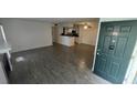 Bright living room with tile floors, fireplace, and access to patio at 5587 Devonbriar Way # 104, Orlando, FL 32822