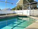 Inviting screened pool with tiled deck at 12061 Greco Dr, Orlando, FL 32824
