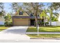 Two-story house with a two-car garage and well-maintained lawn at 1624 Valmont Ln, Apopka, FL 32703