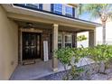 Inviting front porch with stone accents and landscaping at 1624 Valmont Ln, Apopka, FL 32703