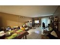 Condo living room with tiled floors and a dining area at 197 Scottsdale Sq # 197, Winter Park, FL 32792