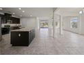 Bright and spacious living area featuring tile floors and a sliding glass door to the backyard at 4032 Prairie Reserve Blvd, Orlando, FL 32824