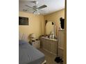 Comfortable bedroom with dresser, nightstand, and ceiling fan at 7262 Hickory Branch Cir, Orlando, FL 32818