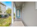 Teal front door entry with a walkway leading to the house at 8763 Laureate Blvd, Orlando, FL 32827