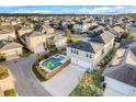 Aerial view of a house with a pool and a large backyard in a residential neighborhood at 9085 Yonath St, Orlando, FL 32827