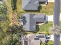 Aerial view of the home showcasing the roof, landscaping, and surrounding neighborhood at 2122 King Richards Ct, Orange City, FL 32763