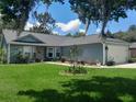 Charming single-story home features a well-manicured lawn and attached two car garage at 2122 King Richards Ct, Orange City, FL 32763