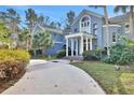 Grand entrance with columns and lush landscaping at 2229 Earleaf Ct, Longwood, FL 32779