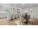 Modern dining area with kitchen island and six chairs at 2800 E Anderson St, Orlando, FL 32803