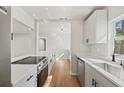 Updated kitchen featuring white shaker cabinets and quartz countertops at 2800 E Anderson St, Orlando, FL 32803