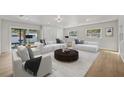 Bright living room with ample seating and large sliding glass doors at 2800 E Anderson St, Orlando, FL 32803