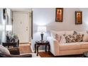 Comfortable living room featuring a cozy sofa and hardwood floors at 293 Scottsdale Sq # 293, Winter Park, FL 32792