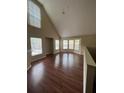 Spacious living room with hardwood floors and large windows at 6348 Raleigh St # 1311, Orlando, FL 32835