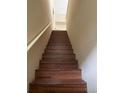 Indoor view of wooden staircase leading upstairs at 6348 Raleigh St # 1311, Orlando, FL 32835