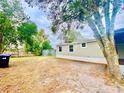 Large backyard with a shed and mature trees at 6668 Pompeii Rd, Orlando, FL 32822