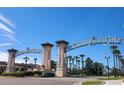 Champions Gate community entrance with palm trees and signage at 8145 Roseville Blvd, Davenport, FL 33896