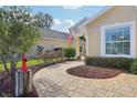 Landscaped walkway leading to the front entrance of the house at 823 Cunningham Dr, Davenport, FL 33837