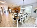 Large dining room table with seating for eight at 8848 Candy Palm Rd, Kissimmee, FL 34747