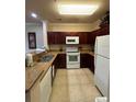 Modern kitchen with granite countertops and stainless steel appliances at 1351 Tuscan Ter # 8401, Davenport, FL 33896