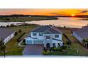 Luxury home with lake view and landscaped yard at 16750 Sanctuary Dr, Winter Garden, FL 34787