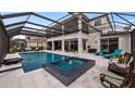 Resort-style pool and spa with covered patio at 16750 Sanctuary Dr, Winter Garden, FL 34787