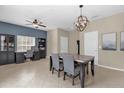 Dining area with a table and chairs, built-in bench seating, and access to kitchen at 20811 Sullivan Ranch Blvd, Mount Dora, FL 32757