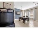Bright dining room with a table, bench, and decorative wall art at 20811 Sullivan Ranch Blvd, Mount Dora, FL 32757
