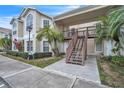 Front view of condo with stairs and walkway at 2321 Prime Cir # B, Kissimmee, FL 34746