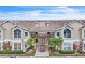 Two-story condo building with stairs and balconies at 2321 Prime Cir # B, Kissimmee, FL 34746