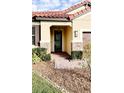 Front entry with brick columns and a modern door at 273 Ancona Ave, Debary, FL 32713