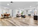 Open concept dining area with stylish table and chairs, adjacent to living room at 4403 Brooke St, Orlando, FL 32811