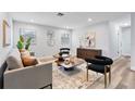 Light and airy living room with contemporary decor and hardwood floors at 4403 Brooke St, Orlando, FL 32811