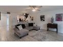 Open living area featuring a comfortable sectional sofa and stylish decor at 5437 Lake Margaret Dr # C, Orlando, FL 32812