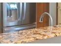Kitchen boasts granite countertops and stainless steel appliances at 762 S Edgemon Ave, Winter Springs, FL 32708