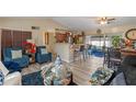 Open living area with a kitchen island and a view to screened patio at 762 S Edgemon Ave, Winter Springs, FL 32708