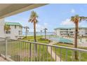 Balcony view of the community pool and the Atlantic Ocean at 815 Ocean Shore Blvd # U9A, Ormond Beach, FL 32176