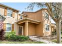 Welcoming entryway featuring a covered porch and well-maintained landscaping at 9025 Savannah Julip Ln, Orlando, FL 32832