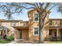 Inviting townhouse with a well-manicured lawn and charming curb appeal at 9025 Savannah Julip Ln, Orlando, FL 32832