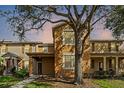 Charming townhouse with a warm exterior, perfect for a cozy evening at 9025 Savannah Julip Ln, Orlando, FL 32832