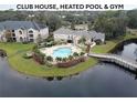 Resort-style amenities including pool, clubhouse and gym at 940 Village Trl # 8-101, Port Orange, FL 32127